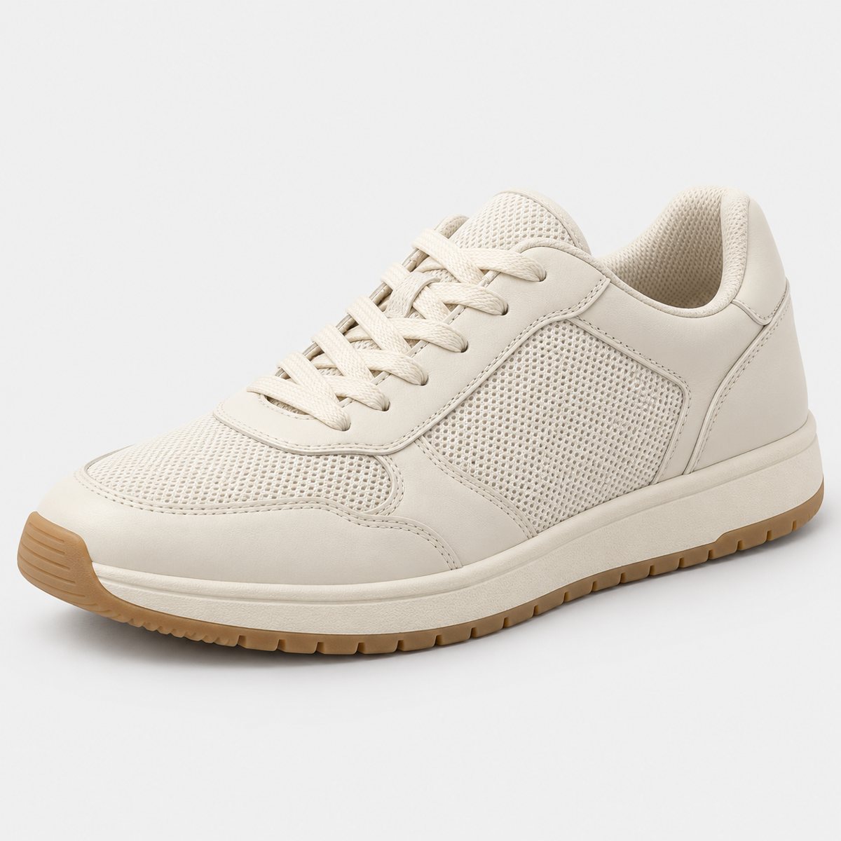 The original photo: a cream leather and mesh trainer with a gum sole on a plain light grey background